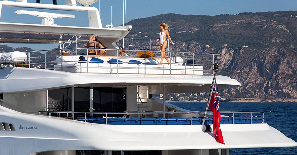 charter guests enjoy the relaxation options on sundeck of motor yacht MISCHIEF 