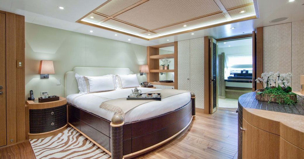 Spacious guest cabin with central berth onboard charter yacht HEMISPHERE