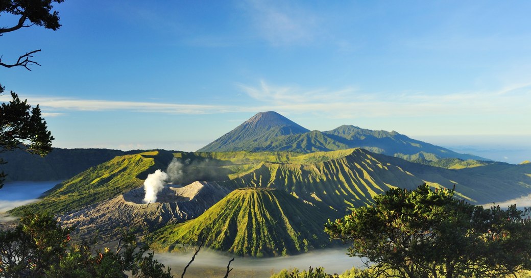 beautiful vista of Mount Bromo against clear blue sky in Java, Indonesia