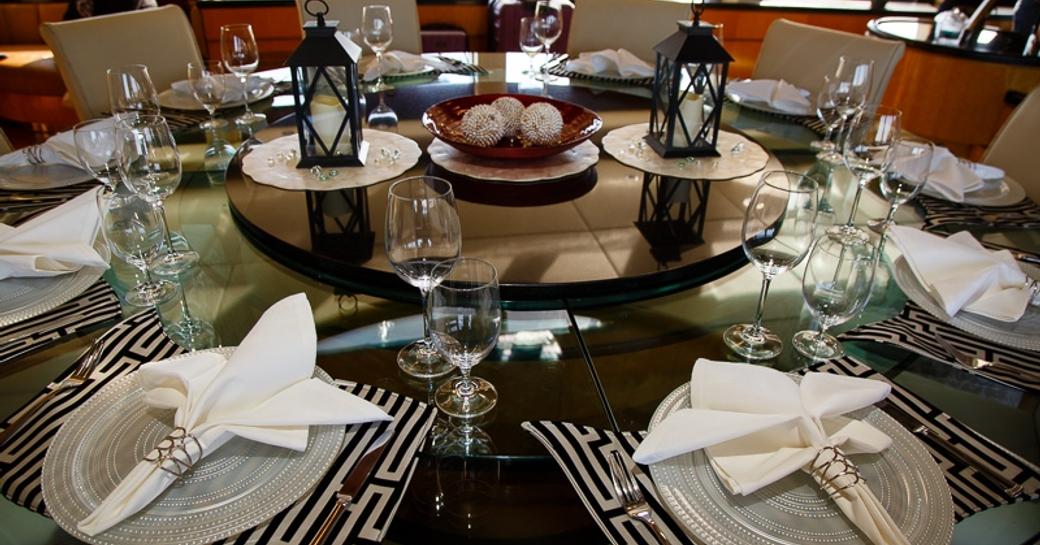 Close up of dining set up on board luxury yacht Island Heiress