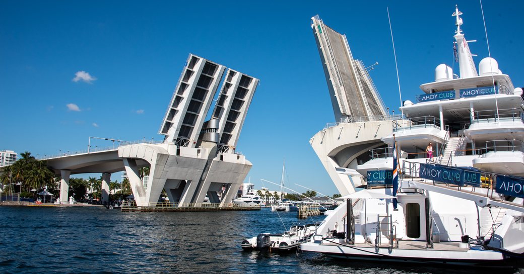 Elevated bridge spanning across the Fort Lauderdale marina, with the AHOY Club in the foreground
