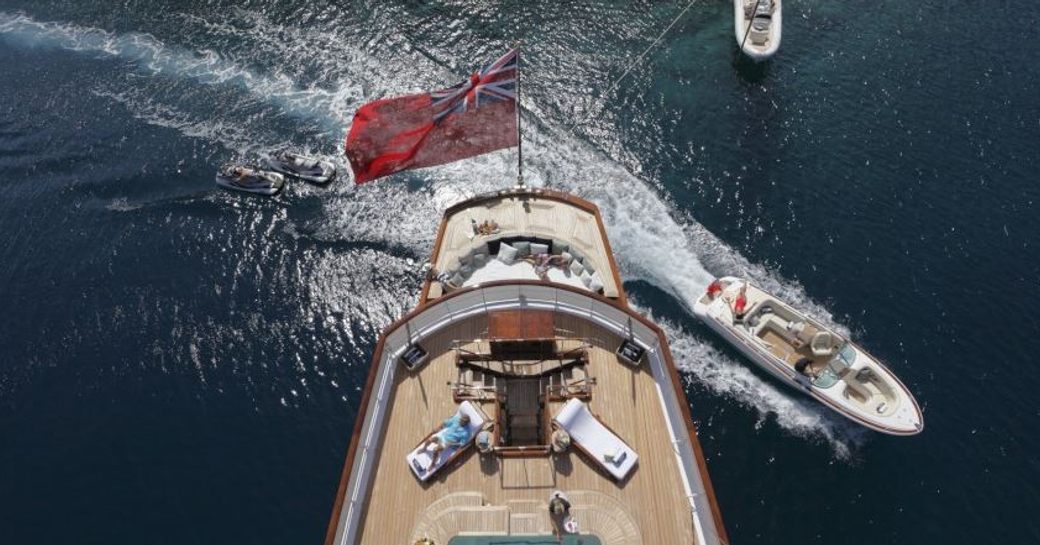 An aerial image of superyacht TALITHA and her extended tender