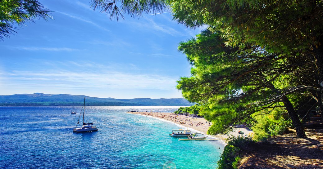 yacht on sea near beach in croatia