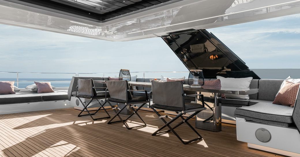 the spacious sundeck of charter yacht The main salon of charter yacht OTOCTONE 80 as the sun shines high above her cruise in the med