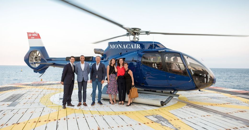helicopter takes winners of quiz MYS 2018 countdown launch in front of helicopter