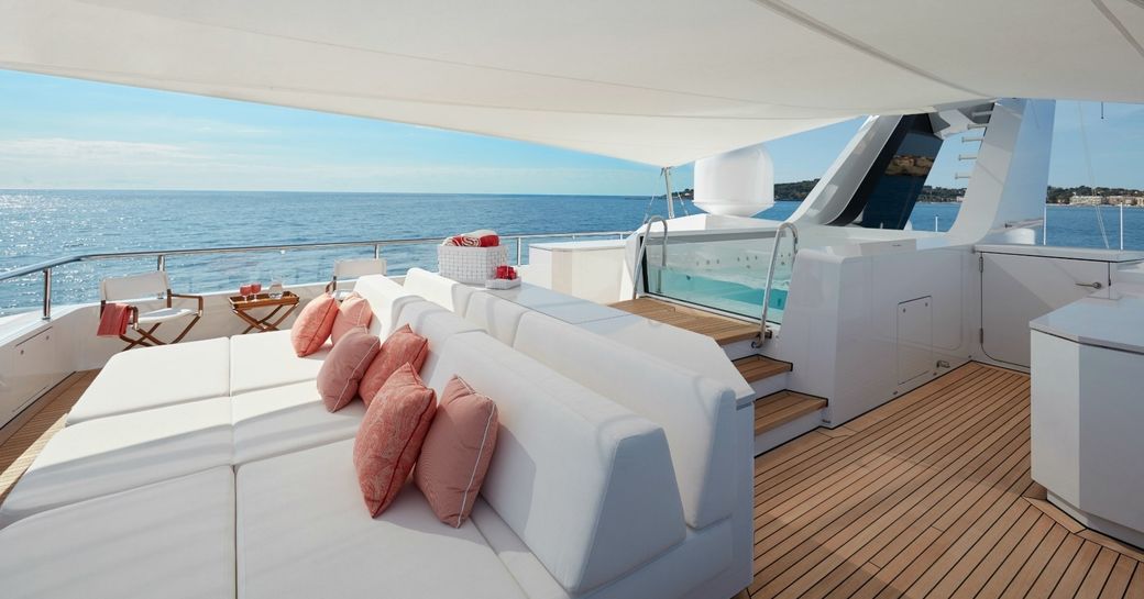 sun pads and pool on sundeck of charter yacht JOY 