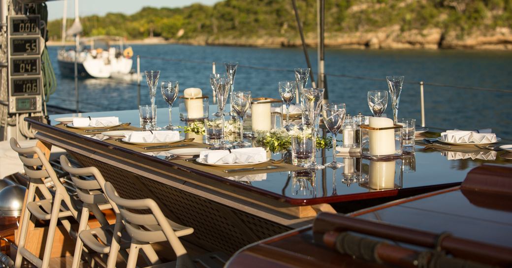 dining for eight on the foredeck of sailing yacht RAINBOW