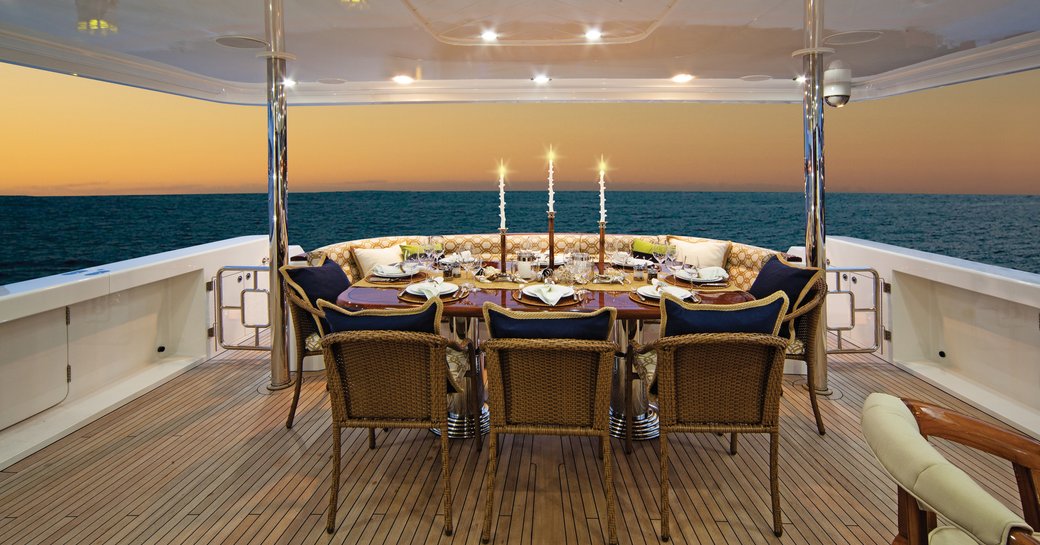alfresco dining on board motor yacht ‘Second Love’ as sun sets over the horizon in Cuba