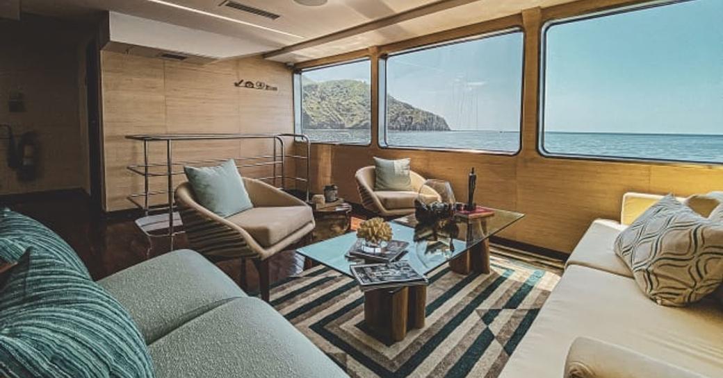 Lounge area with big windows onboard charter yacht KONTIKI WAYRA