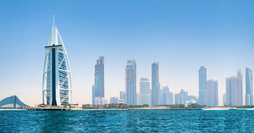 Overview of the Dubai skyline with the sea in the foreground