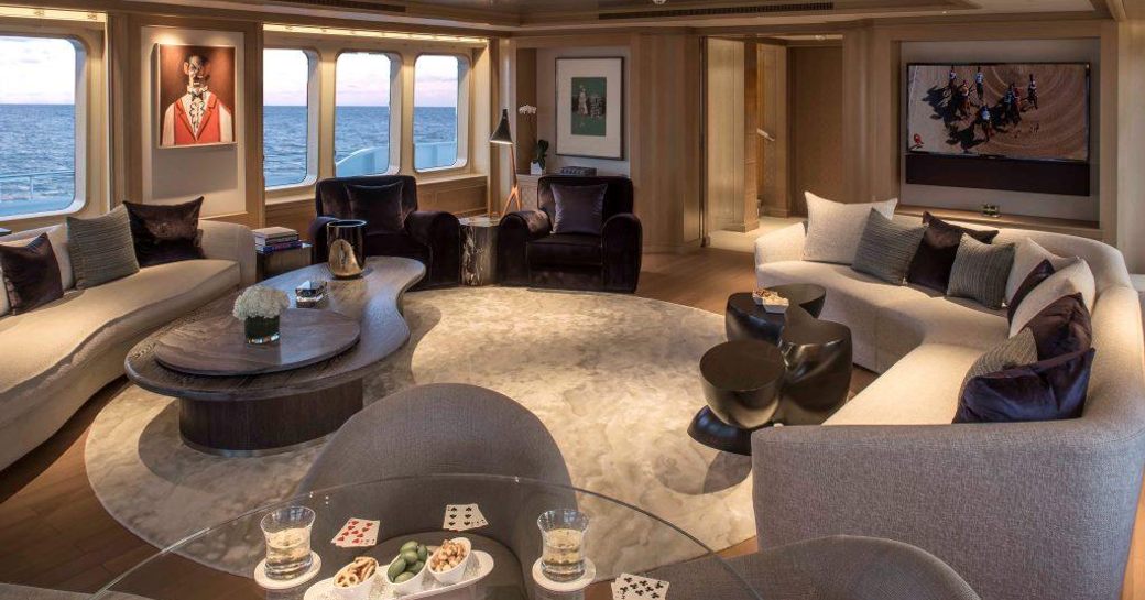 sociable seating area flanked by large windows on board superyacht SAMADHI 