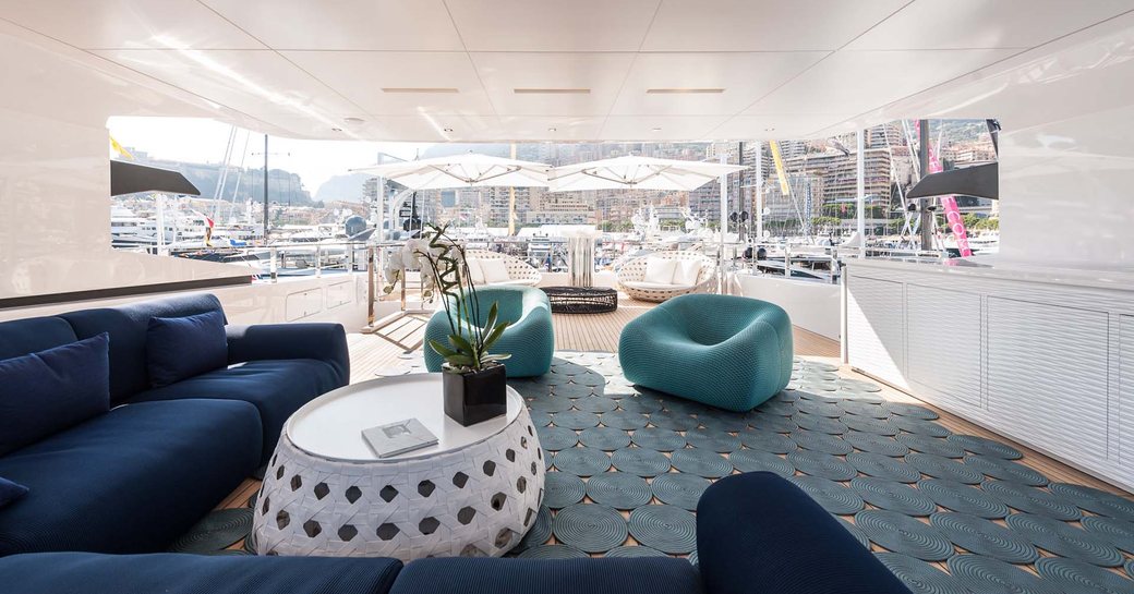 deep L-shaped sofa under radar arch on the sundeck of luxury yacht ENTOURAGE 