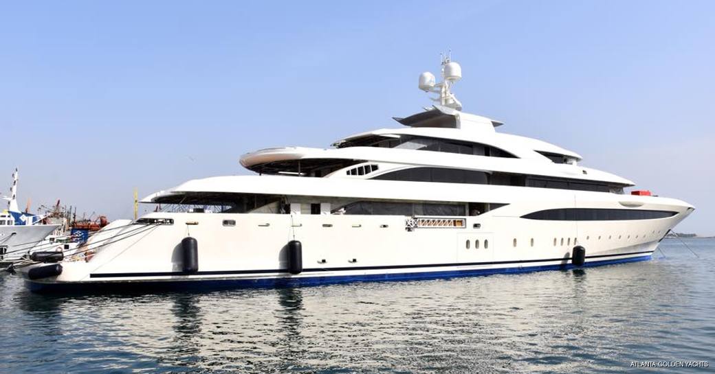 Superyacht O'PTASIA sat at-anchor showing off her starboard side