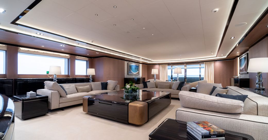 main salon with large sofas on board motor yacht O’PTASIA
