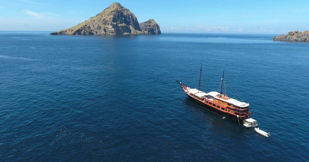 A Luxury gulet approaches an island close to Indonesia