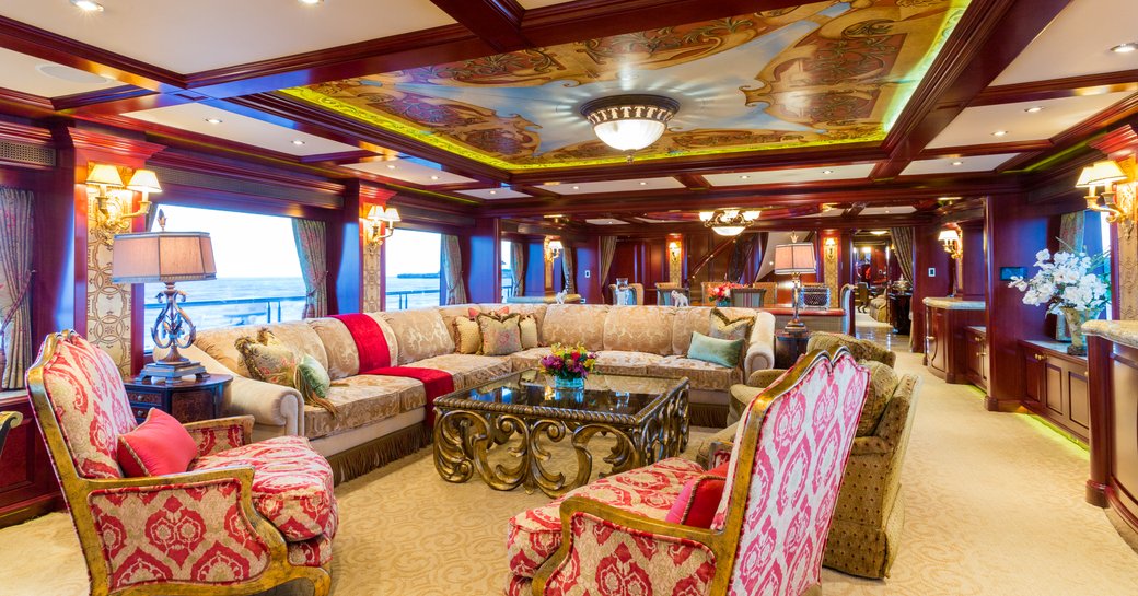 beautiful main salon aboard charter yacht ‘Amarula Sun’ with hand-painted mural ceiling and lounge area