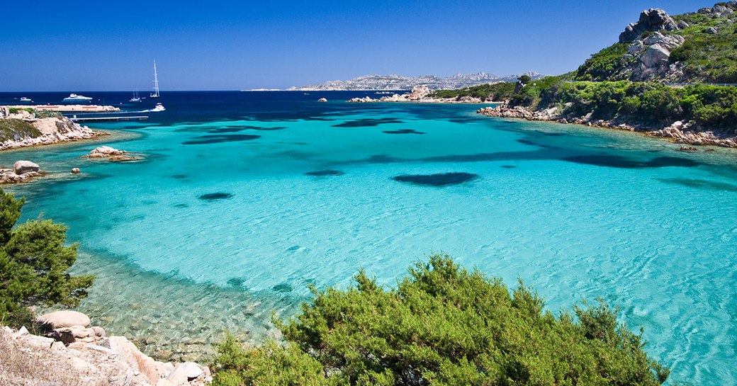 Bright turquoise clear water in bay in Sardinia, Costa Smeralda in Italy