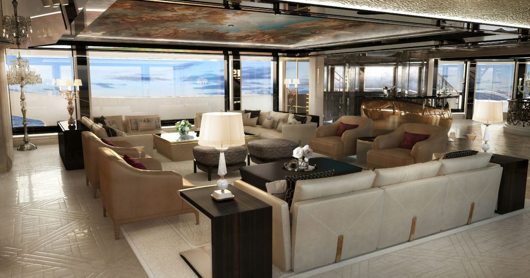 Main salon onboard charter yacht KISMET, plush seating arranged a coffee table and full height windows in the background