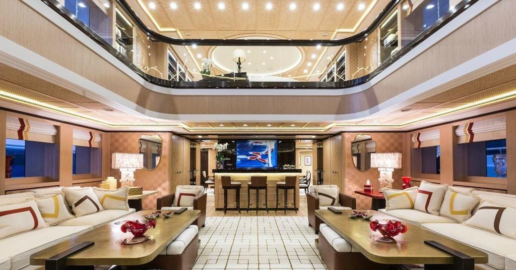 The dual level main salon of luxury yacht AXIOMA
