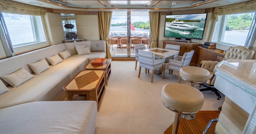Overview of the main salon onboard Charter yacht ARTEMISEA, with spacious lounge area port and a wet bar starboard