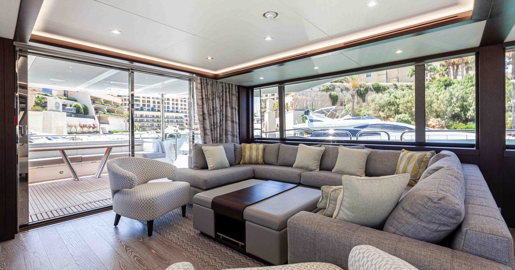 Overview of the lounge in the main salon onboard charter yacht NEW EDGE
