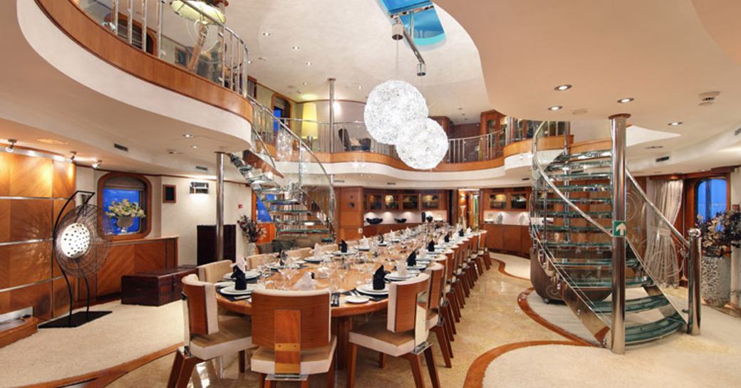 The atrium and formal dining area available on board superyacht  SHERAKHAN