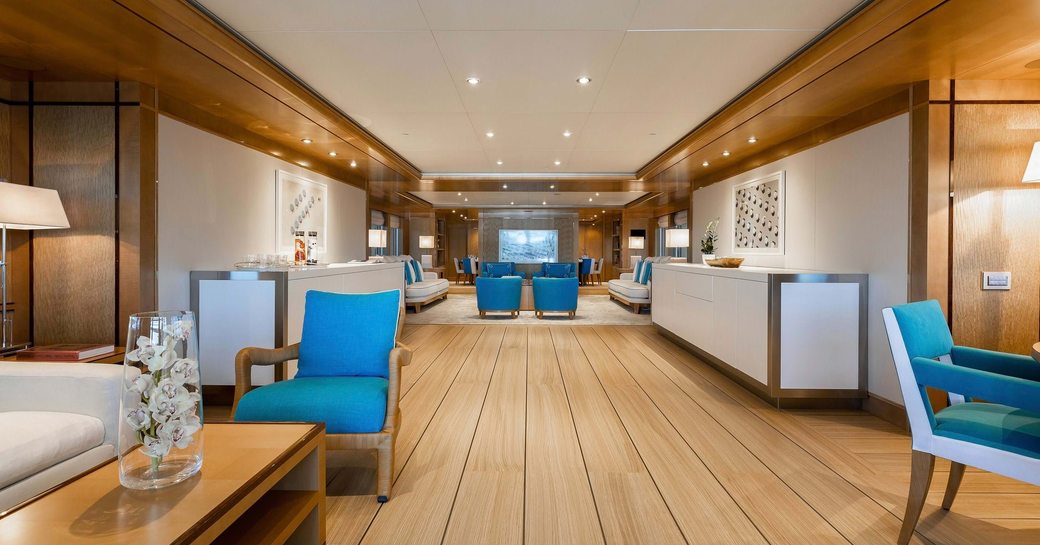 Overview of the main salon onboard charter yacht AIFER, seating to port and starboard.