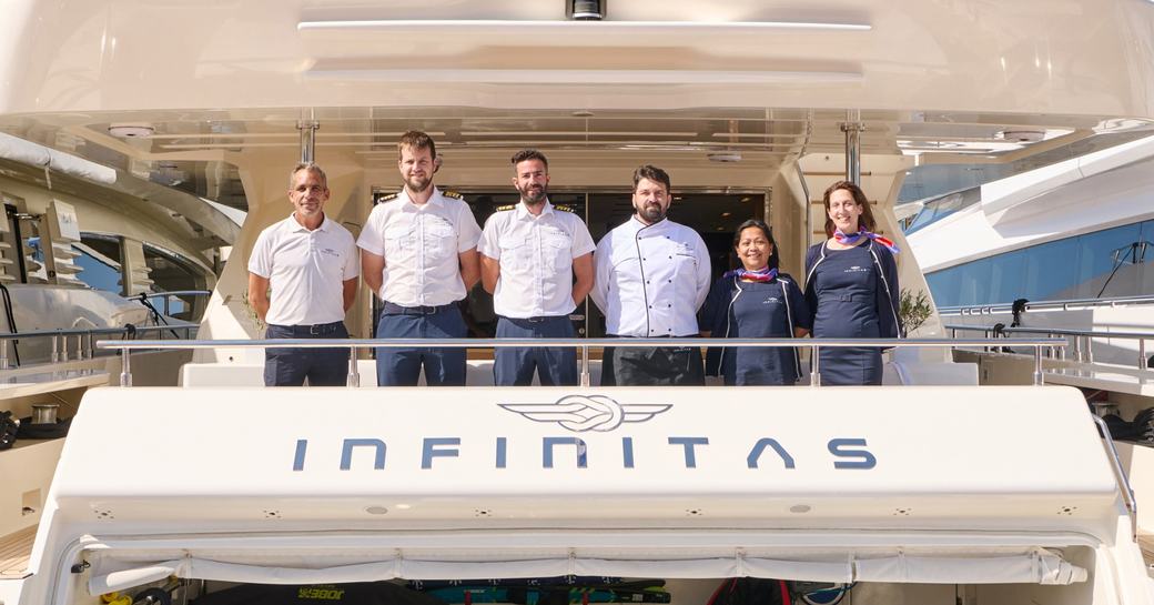 Crew onboard superyacht charter INFINITAS