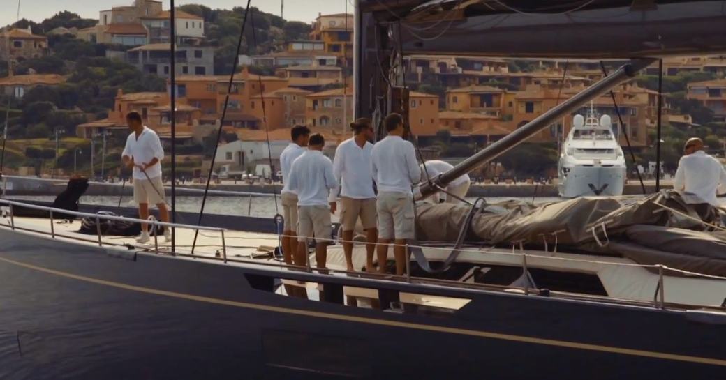 Crew in white tops and shorts attending