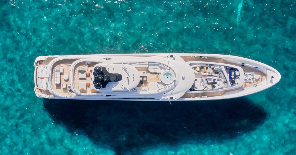 beautiful charter yacht ARKADIA cruising through crystal clear waters
