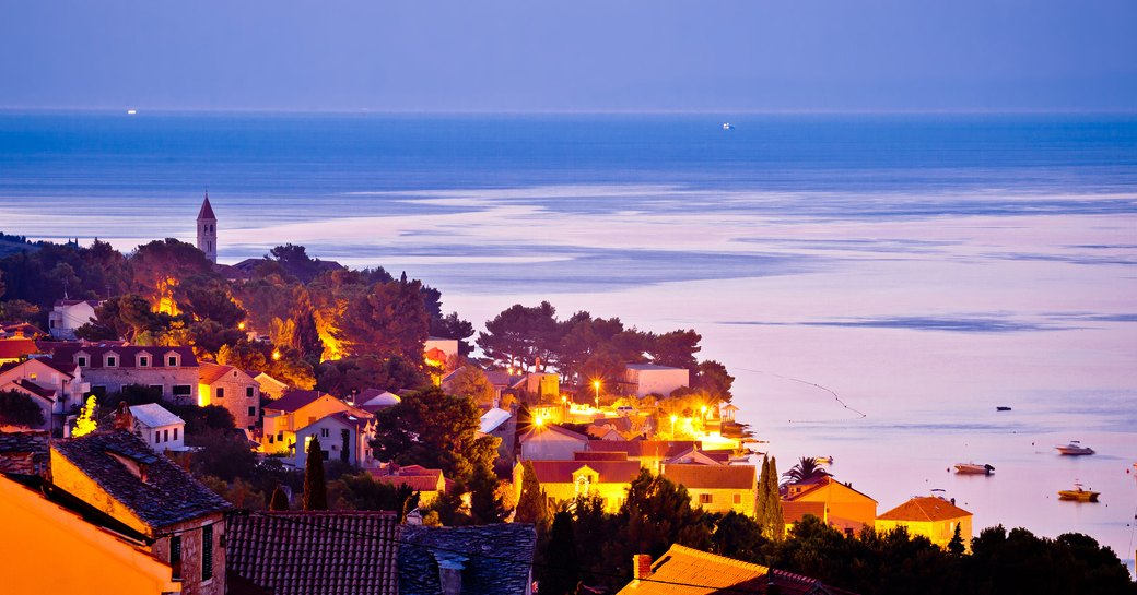 a buzzy croatian town as the sun sets on a summer's bight