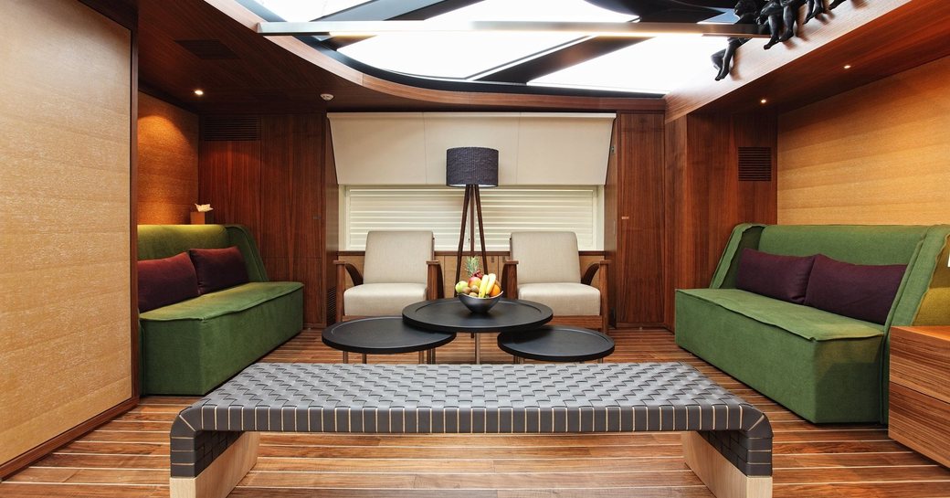 salon in the walnut and maple interior aboard superyacht ‘State of Grace’