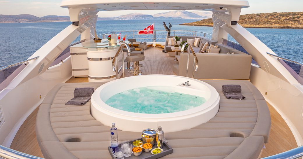 Jacuzzi and sunpads on sundeck of luxury yacht Aqua Libra
