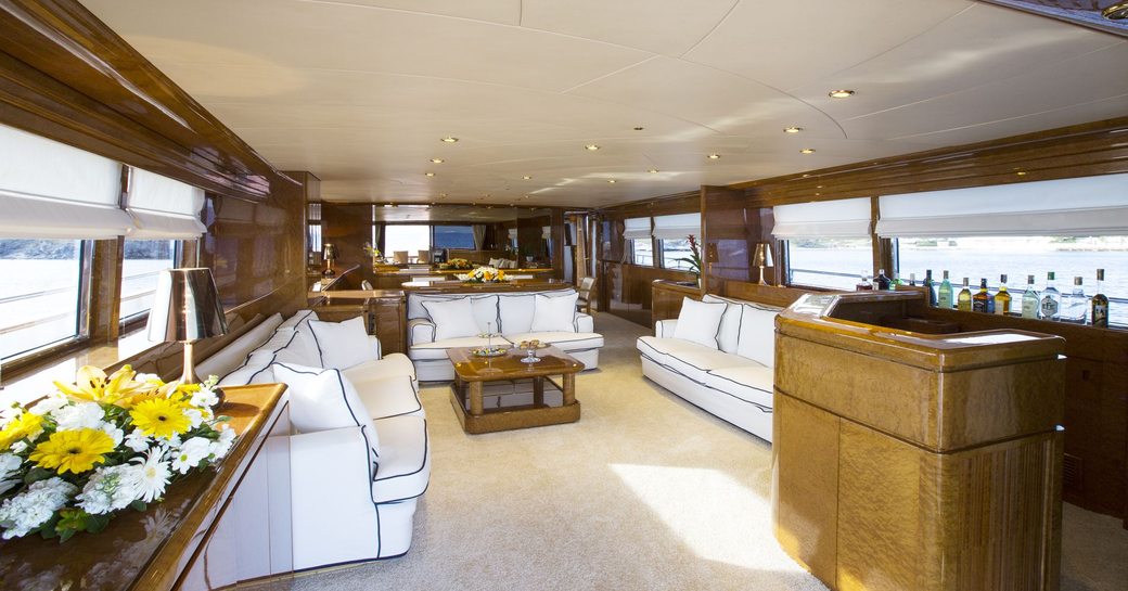 spacious lounge in main salon of charter yacht NOMI 