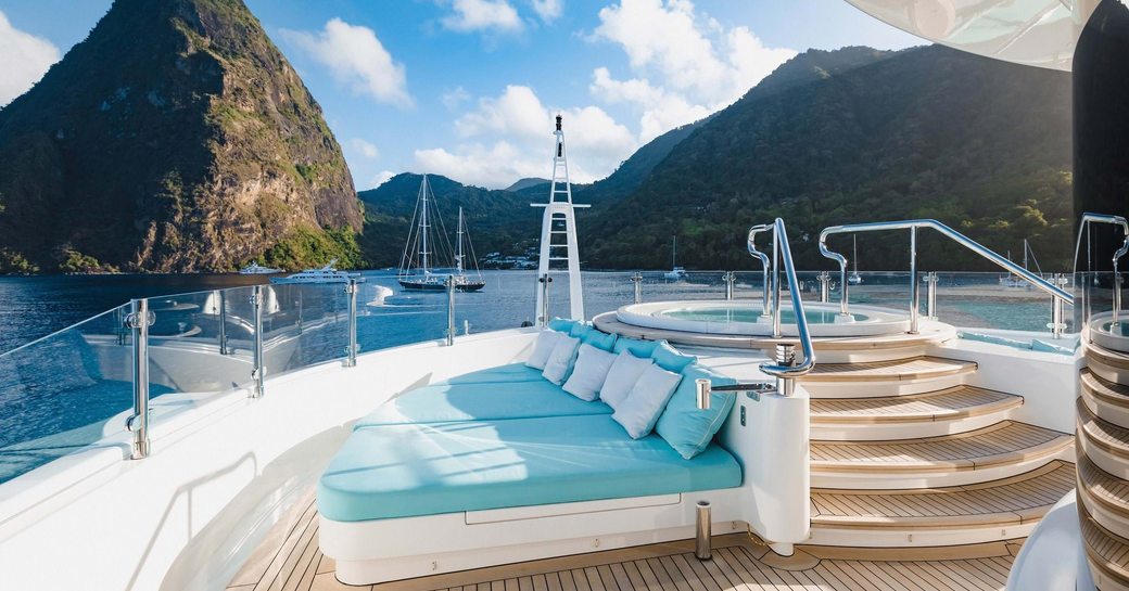 plush sunbeds surrouning Jacuzzi on luxury charter yacht aifer