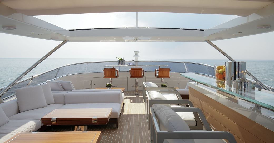 bar and comfortable lounge area on sundeck of luxury yacht SKYLER 