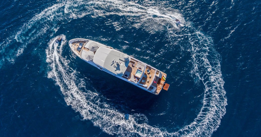 aerial shot of luxury yacht NARVALO with tender
