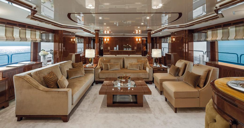 main salon with two semi-private seating areas on board superyacht CHECKMATE 