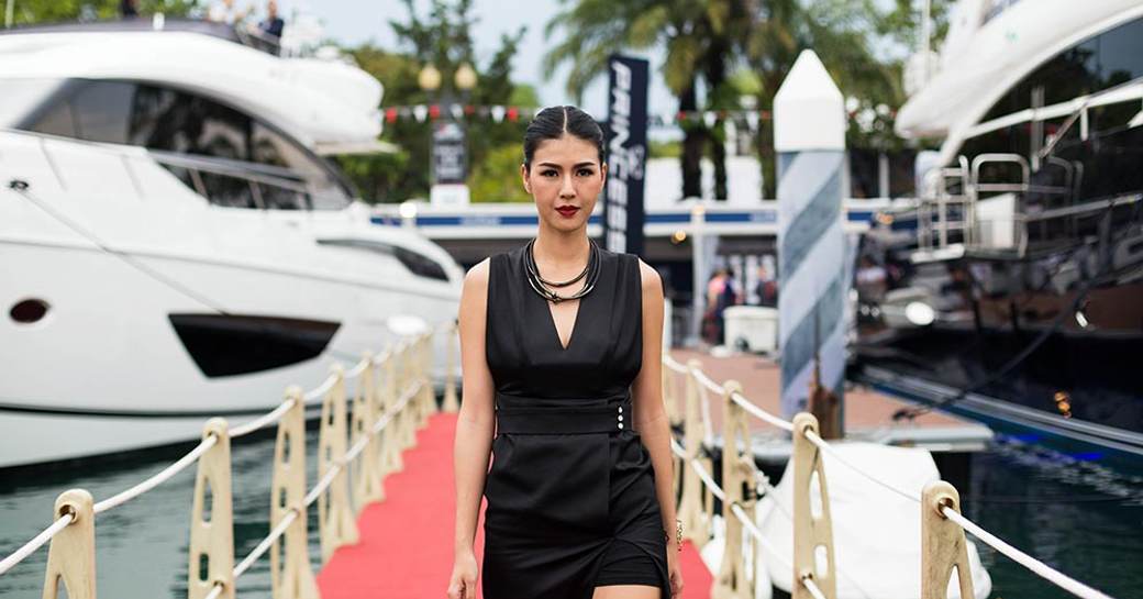 model walks the boardwalks of Singapore Marina at the Singapore Yacht Show 2017