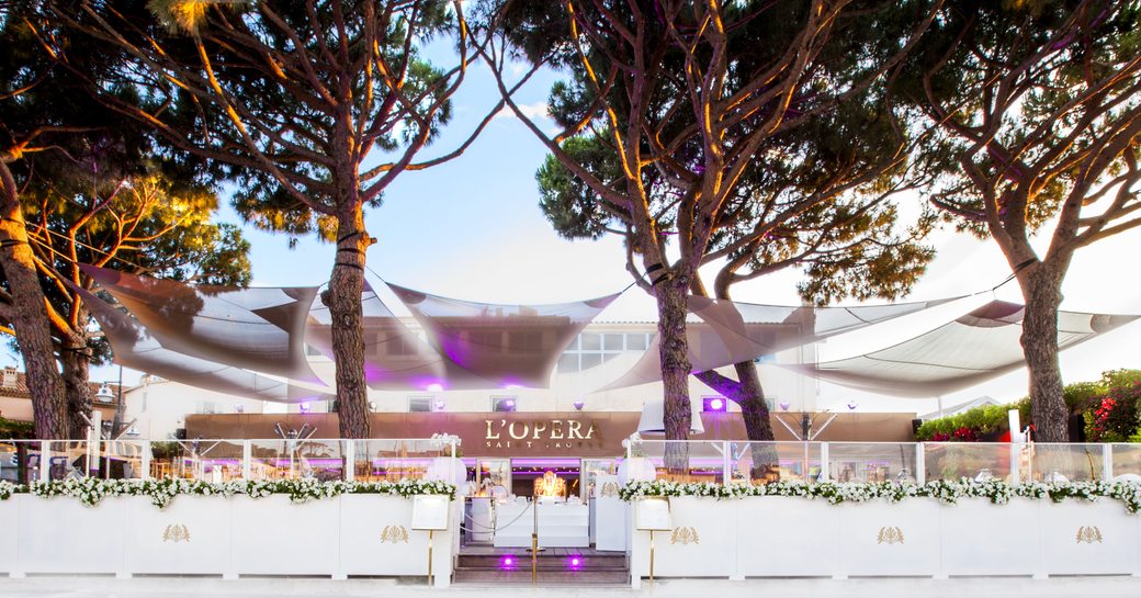L'Opera restaurant in St Tropez, with pine trees and large alfresco terrace