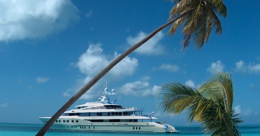 AXIOMA in the Caribbean with palm trees in foreground