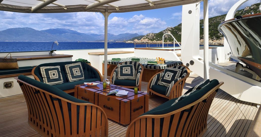 green coloured seating area on deck of expedition yacht Steel