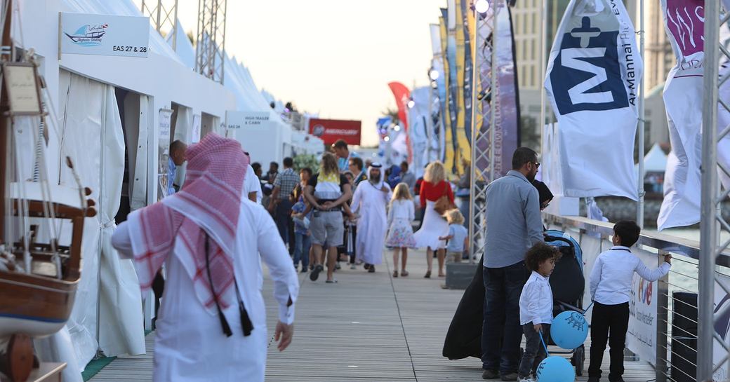 exhibitor tents lining the boardwalks at the Qatar International Boat Show