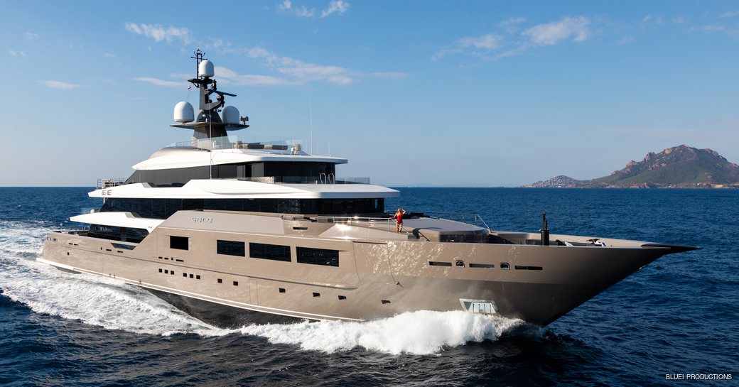 Superyacht SOLO underway, with woman on bow