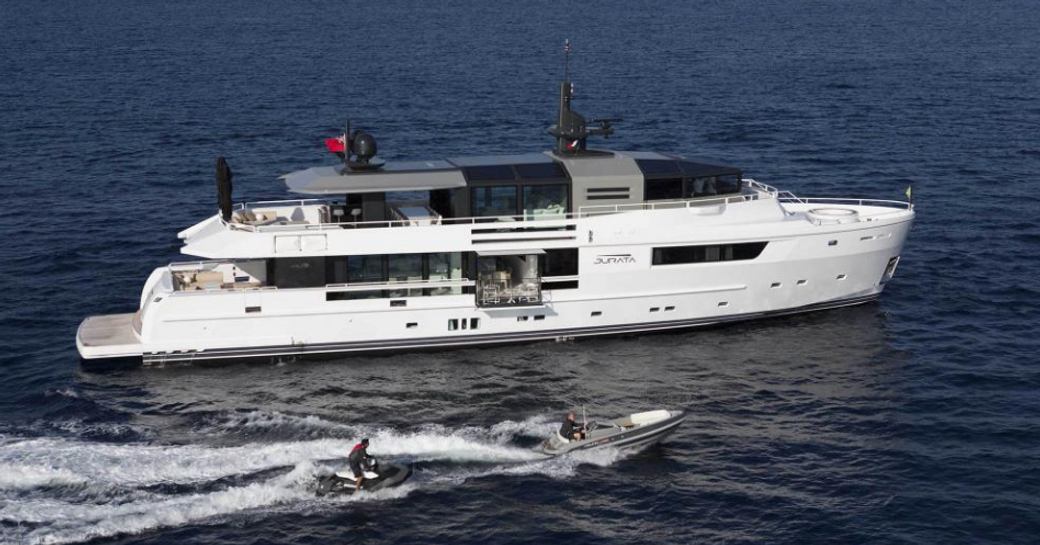 superyacht JURATA cruising on a luxury yacht charter in the Mediterranean alongside tender
