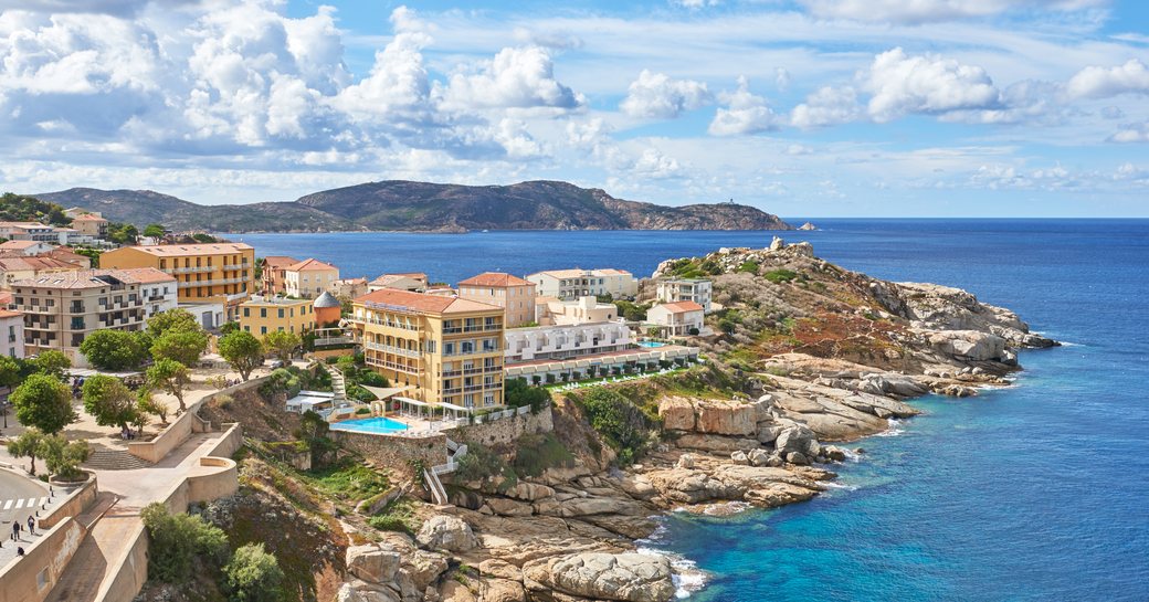 Beach in Corsica, with houses on the shoreline