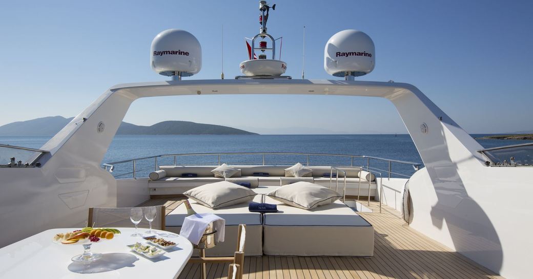 NOMI sunpads and table on sundeck of superyacht NOMI 