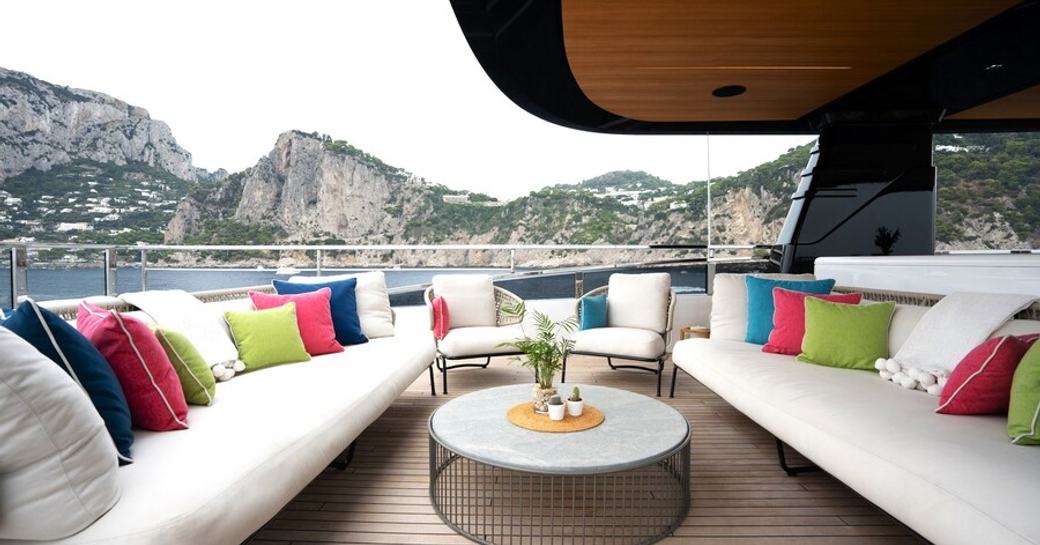 Overview of the aft deck lounge area onboard private yacht charter HALARA