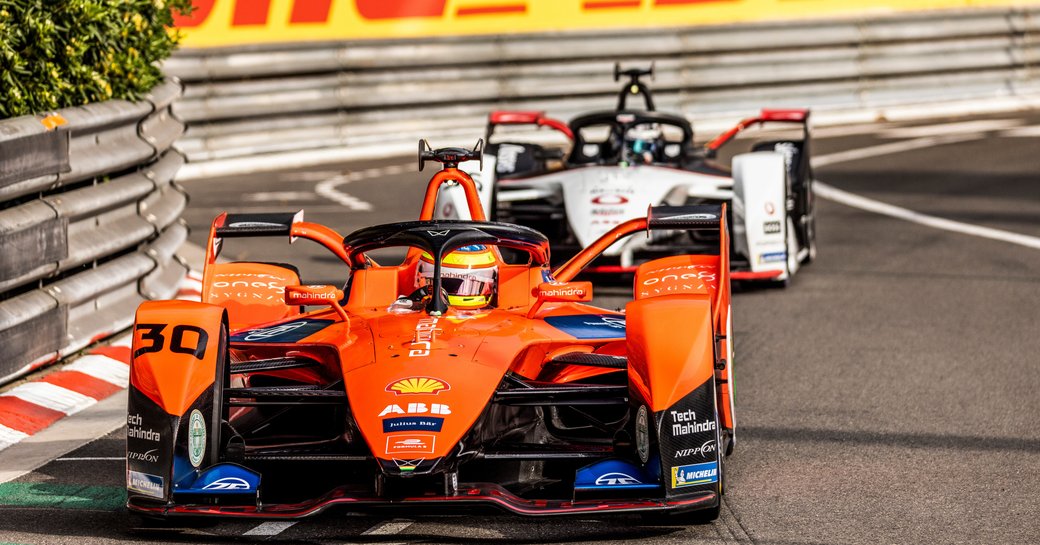 Orange Formula E car during race in Monaco.