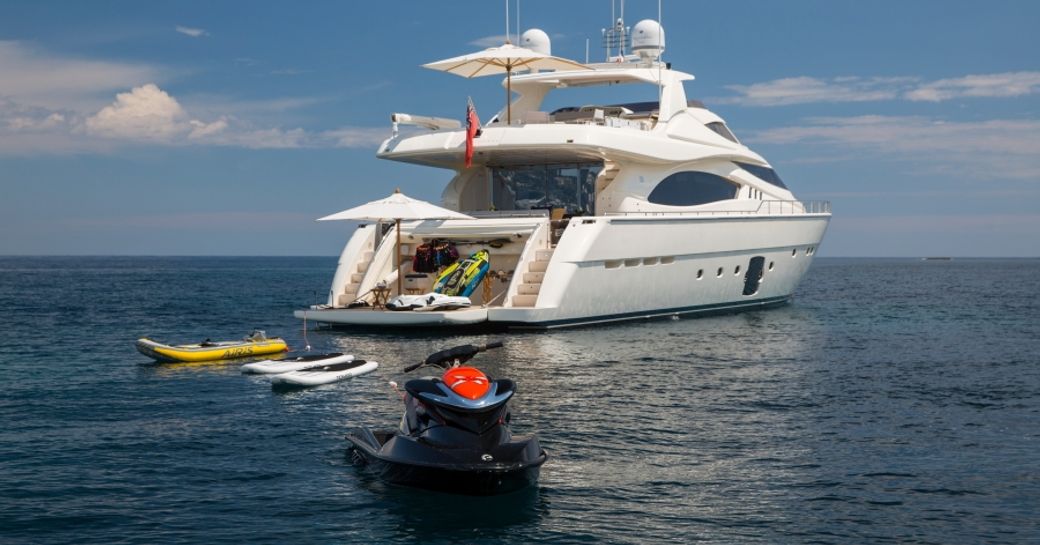 charter yacht Porthos Sans Abri anchors with water toys spread out around her